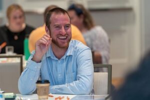 Man smiling at an Able Trust event.